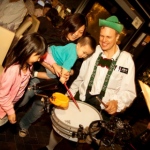 drummer teaches children how to play music 