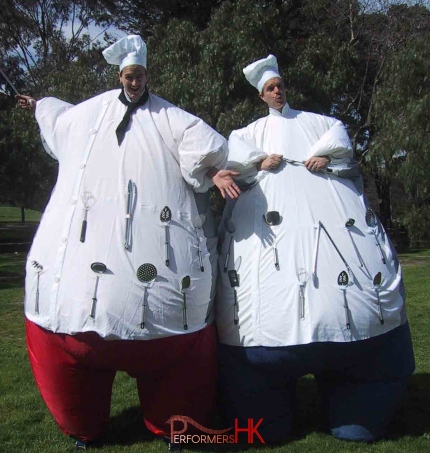 Hong Kong two stilt-walkers dressed as fat chef with giant inflatable chef costumes