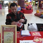 Zodiac paper cutting give away At the Hong Kong Airport Chinese New Year parade.