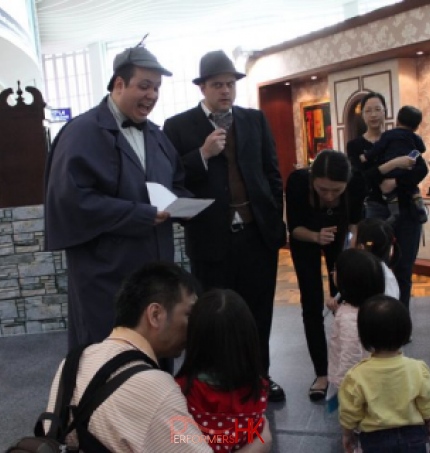 Two Hong Kong professional theater actors running a Easter role play workshop,leading the little detectives to solve the chocolate bunny missing case at the Hong Kong airport