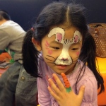 A creative Easter bunny face paint with a carrot finger paint.