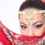 Bollywood Dance costumes feature delicate headpieces and scarves. 