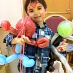 Little guest is so happy with the spider man and Alien balloons.
