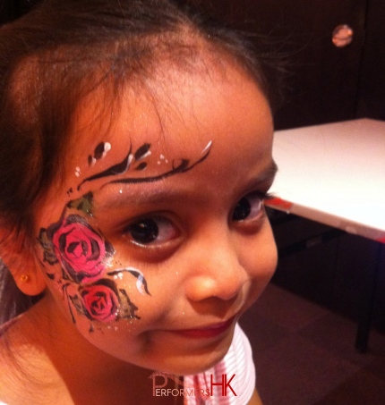 little girl with flower face painting