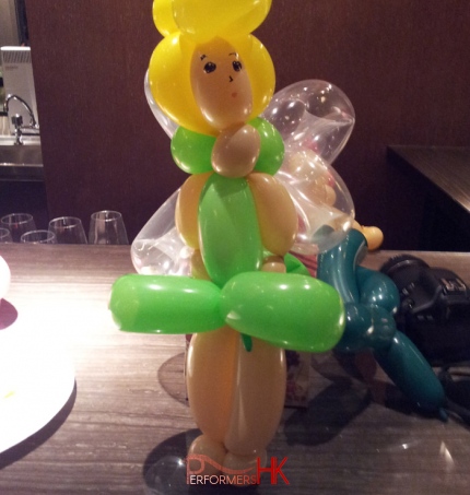 Roving Balloons twister in Hong Kong twisted a Tinker Bell Balloon as a center piece for a corporate dinner event