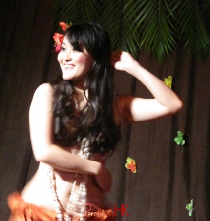 Hula dancer performing traditional Hawaiian hula dance on stage in Hong Kong