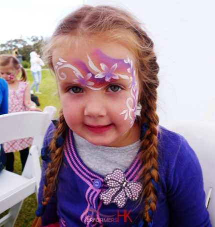 A lovely flower fairy by a face painter at an outdoor school event in HK 