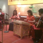 Four Chinese musicians performing at a dinner event