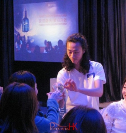 Hong Kong contact juggler performing to a client at a Biotherm product launch event