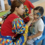 Genie focusing on her work at a school event.