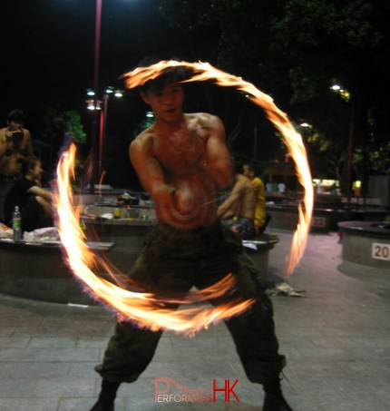 Hong Kong Juggler performing with fire poi at a corporate event