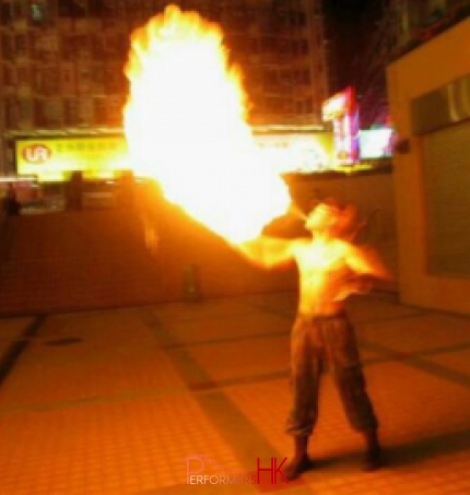Juggler in HK performing breathing fire act a corporate function.