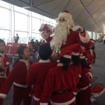 Santa Rowan getting attension from kids at the airport