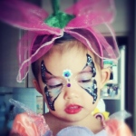 Her signature butterfly face paint. 