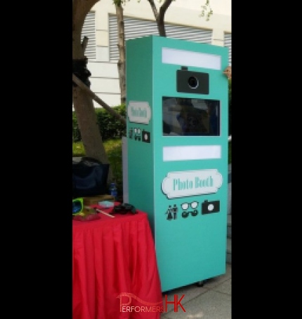 A photo booth machine set up for a corporate school fair event