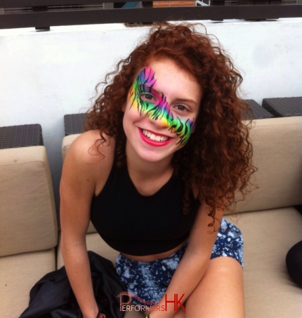 Hong Kong professional face painter draw a rainbow color zebra pattern face paint for a lady who attended a carnival event