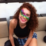 Rainbow color zebra pattern face paint.