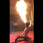 Breathing fire at a festival event.