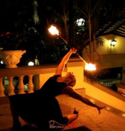 Hong Kong Fire juggler playing fire staff at a corporate annual dinner