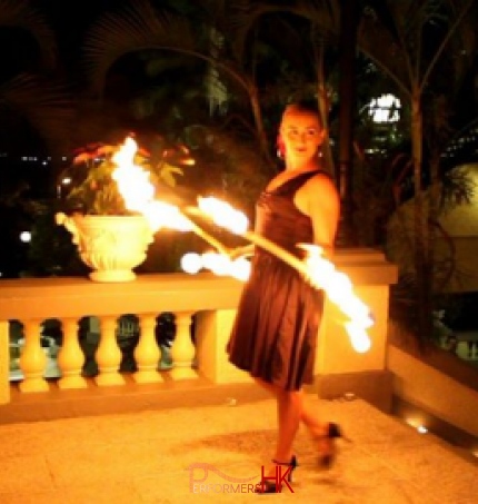 Fire juggler performing with Fire hoop in Hong Kong at a annual dinner