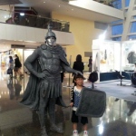 Silver man Centurion human statue wearing custom made costume at Festival walk for American Express. 