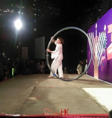 A Hong Kong acrobatics artist performing with wheel at a Hong Kong Xmas corporate event