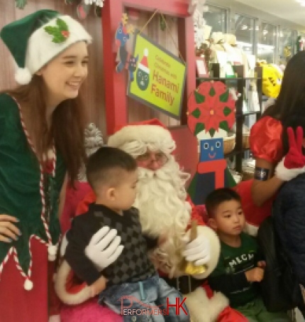 Santa clause and female elf in shopping centre in Hong Kong