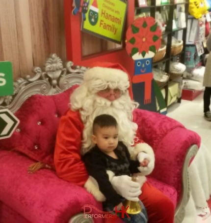 Santa sitting with small child on this throne in SOGO