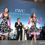 Broadway swing dancer wearing polka dotted dresses on stage.