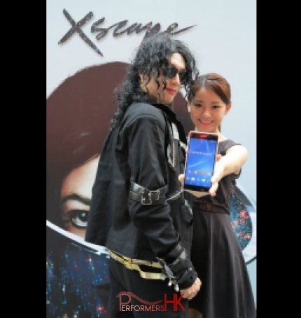 Woman taking selfie with Michael Jackson impersonator