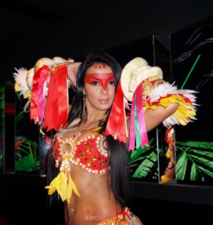 Model with 2 snakes wrapped around her at a corporate function