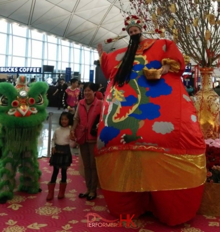 Giant inflatable Choi Sun stilt costume at the Hong Kong airport