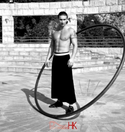 HK acrobatics artist posing with his wheel for a corporate event