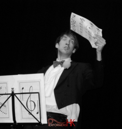 Magician performing a trick with sheet music