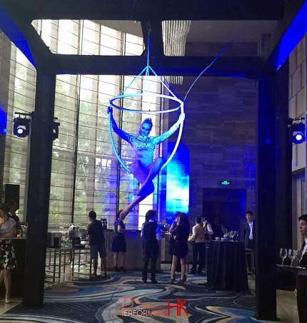Aerial Champagne performer in HK posing on a huge ring at a fashion function at Hilton Hotel 