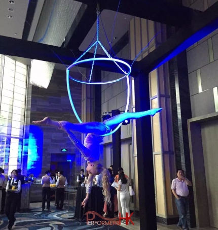 Hong Kong Aerial Champagne performing with elegant movement on the huge ring beside of serving champagne to the guest at the cocktails event