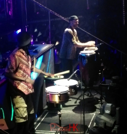 Two drummers playing snare and conga on stage in Hong Kong