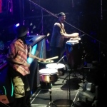 Two drummers playing snare and conga on stage in Hong Kong