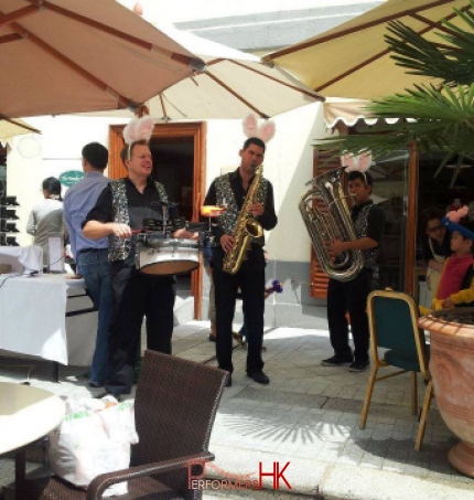 Three roving band musicians performing at a corporate Ester event in Hong Kong 