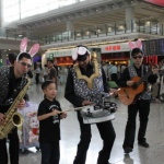 Hong Kong roving magician taking picture with the audience at a the HKIA Easter event