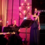 Singer in Hong Kong performing with three musician at a annual dinner in a hotel