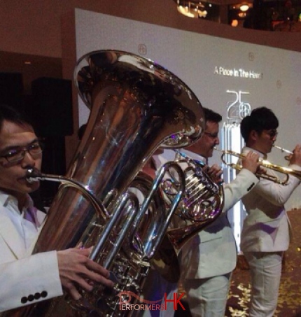 band featuring trumpet and horn performing in white suits