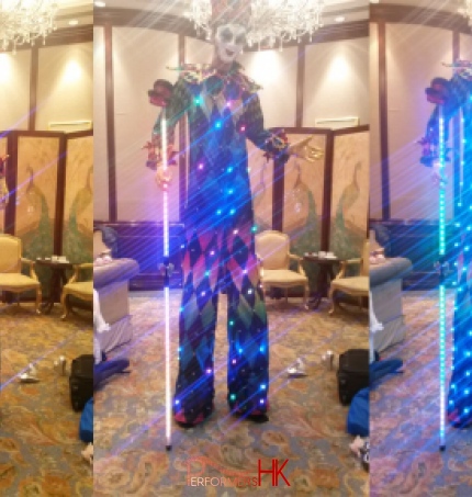 Three pictures of HK stiltwalker in a Venetian LED costume which have different  patterns