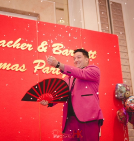 Magician performing snow storm magic trick with a fan at a corporate Christmas party at Aberdeen Marnia Club Hong Kong 