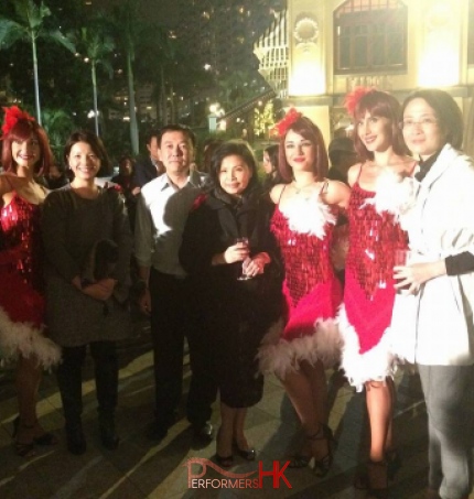 Three Hong Kong Dancers dress as Reindeer girls taking picture with the guests after the dance performance at a corporate Christmas event