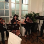 Four Hong Kong String players performing at the wedding reception