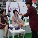 Joker performing some table magic at the Wine and Dine fair.