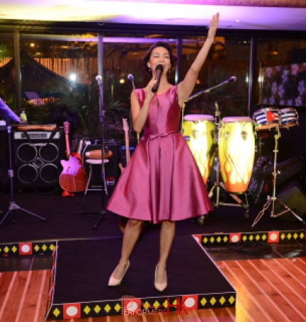 Yamilete in pink dress on stage in Hong Kong