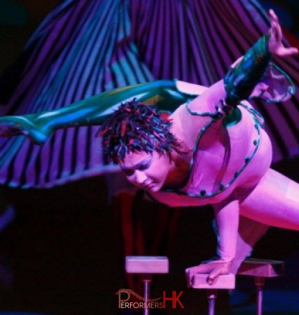 A professional acrobat performing handbalancing at a annual dinner