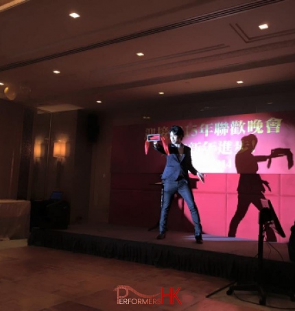 Magician performing stage magic with a box and silk at a Hong Kong corporate annual dinner